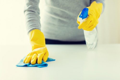 Professional cleaners maintaining office kitchens and communal areas in EC2