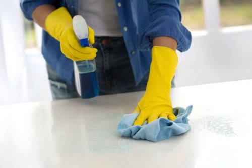 Technician treating carpet stains with careful cleaning methods