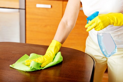 Professional cleaners maintaining an EC2 office kitchen and meeting space